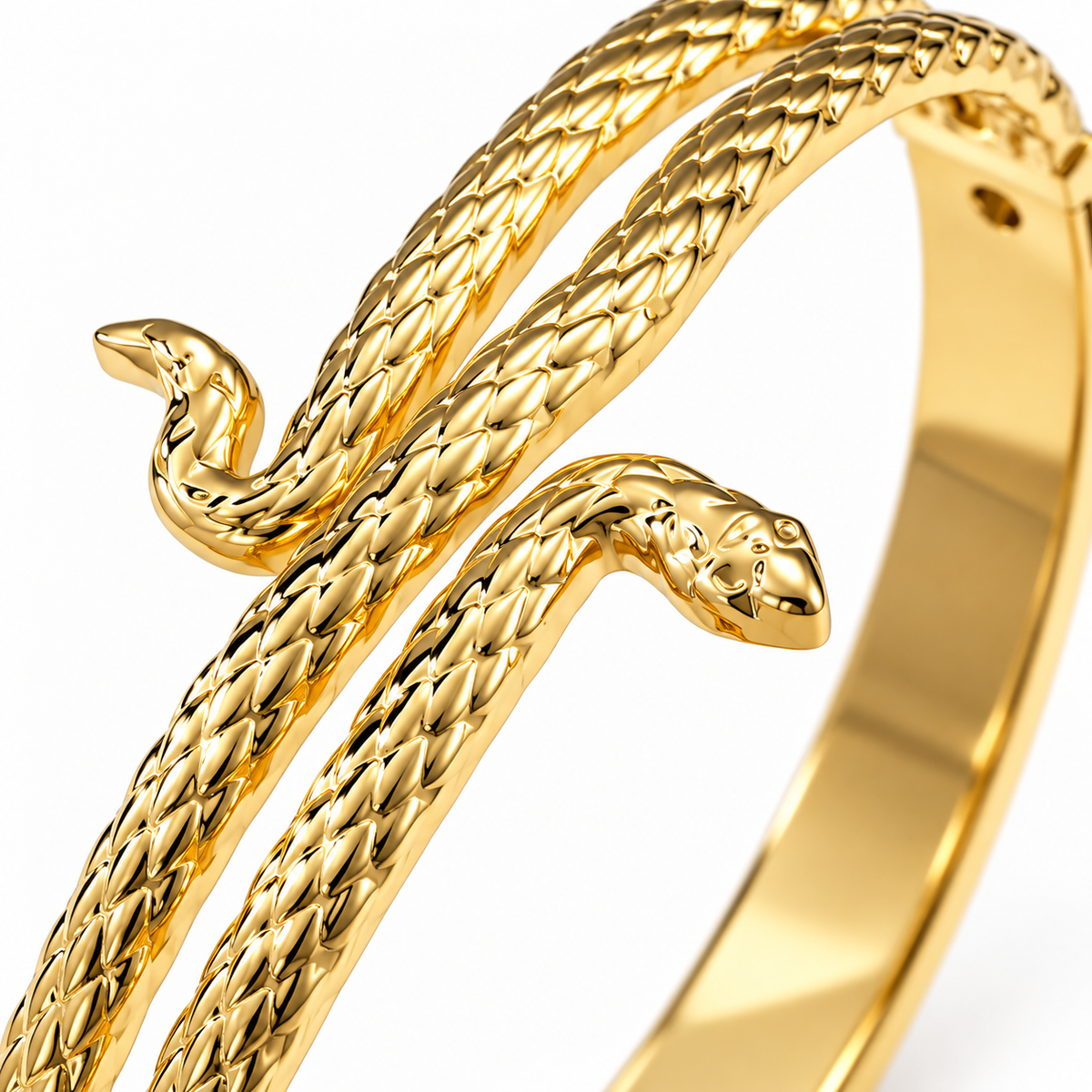Close-up of textured serpent head and gold-tone bands on Lyora bangle