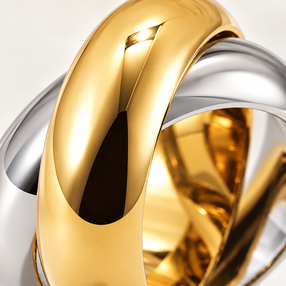 Close-up of gold and silver-tone intertwined bands